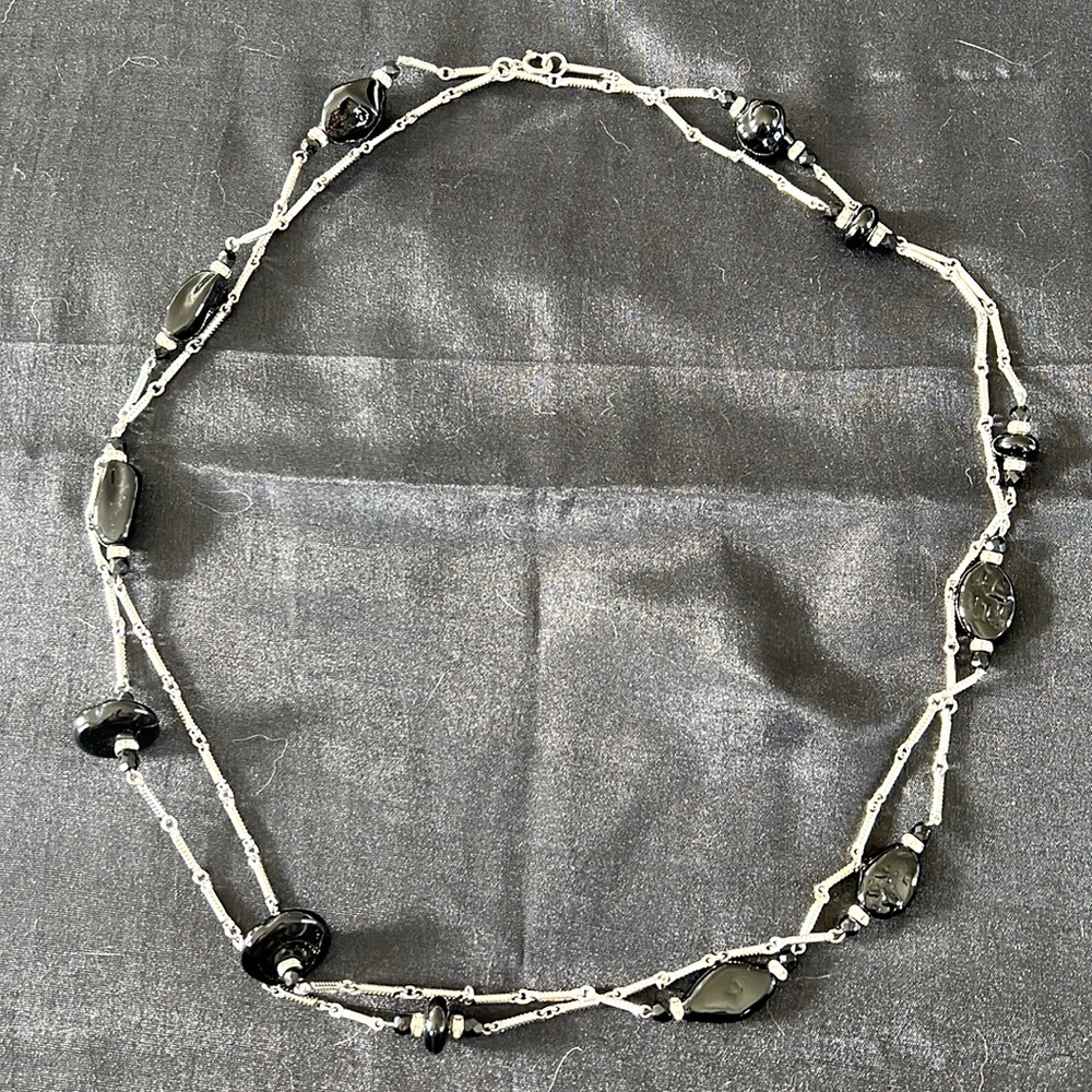 Long silver chain with black beads.  58-60in strand.